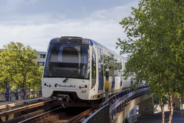 Rotterdam, the Netherlands - 2022-06-03: Rotterdam Randstadrail metro carriage driving on track