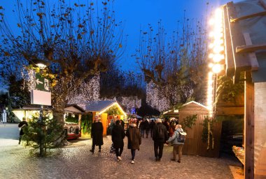 Christmas market in Konstanz next to the lake with food, gifts, mulled wine and many lights. clipart