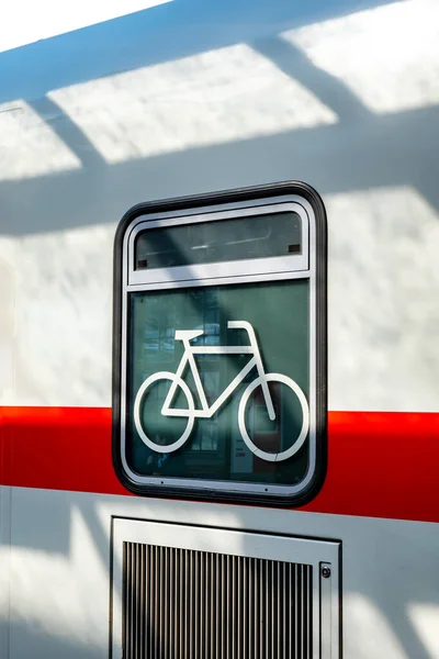 Sign that bicycles can be transported in the train.