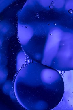 vegetable oil drops in water , abstract background