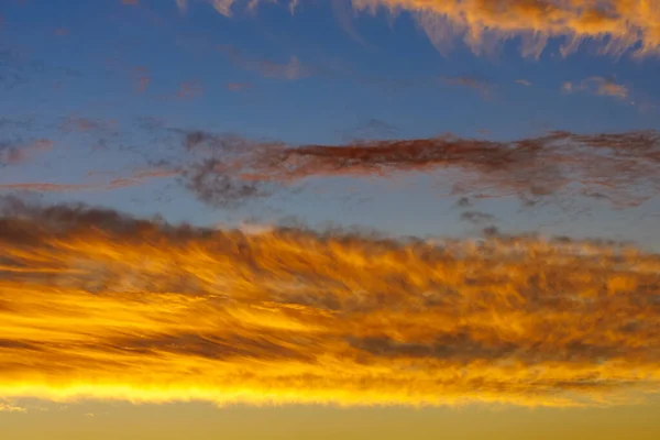 fiery orange clouds , surreal color of the sky , fantastic colors of nature