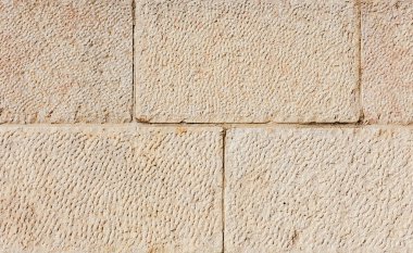 Eski Kudüs duvarının dokusu bej renkli, doğal taşlı. Fotoğraf arka plan olarak kullanılabilir.