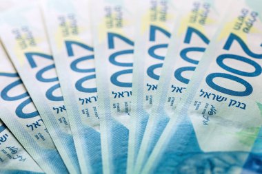 200 şekel değerinde banknotlar, yelpaze, üst görünüm, yeni İsrail parası, kavramsal fotoğraf.
