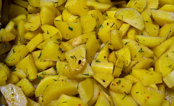 stock image Potato baked in foil with spices.