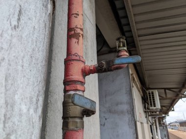 Fire Sprinkler Heads next to the concrete stone pillars
