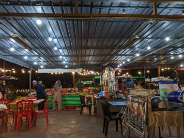 Malaysia, 12 June 2022: The atmosphere is served at night decorated with lights.