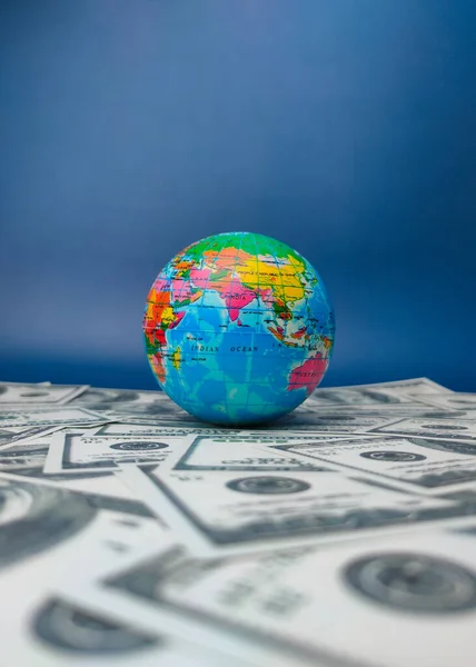 Earth globe on a dollar banknotes. Business concept