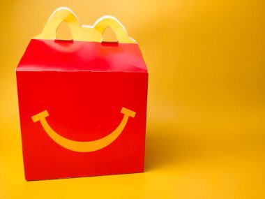 Perak,Malaysia,Febuary 2 2023: Happy Meal box from McDonald on a yellow background.