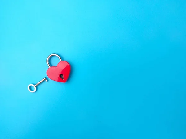 Heart shaped red lock with key. Concept of love forever with padlock.