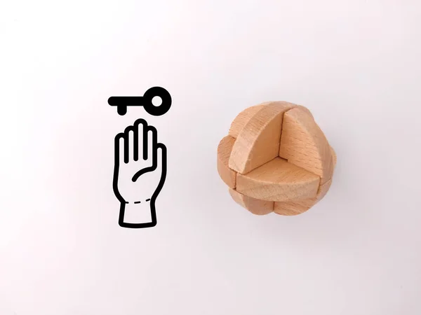 Wooden toy puzzle with solution icons on a white background. Innovation concept.