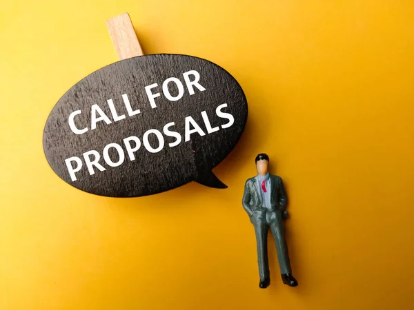 stock image Wooden board and miniature people with the word CALL FOR PROPOSALS on yellow background