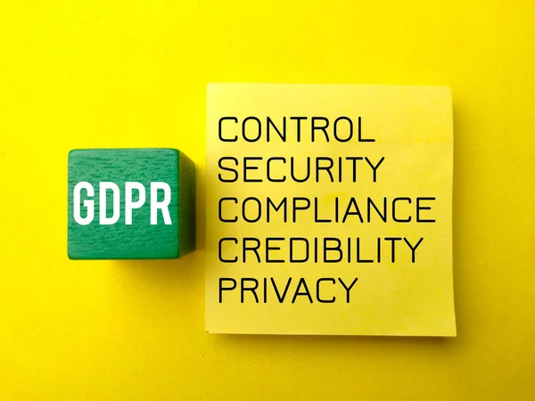 Colored block and sticky note with the word GDPR. The concept of GDPR.