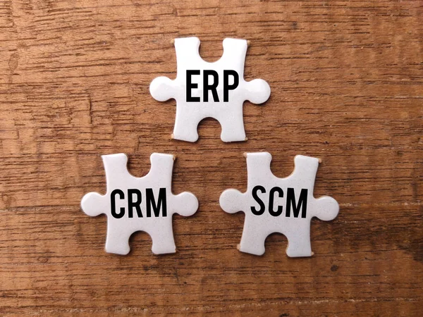Top View White Puzzle Word Erp Crm Scm Wooden Background — Stock Photo, Image