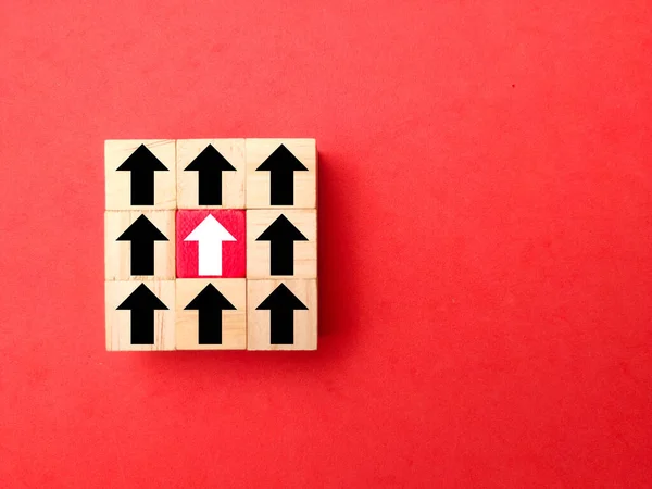 stock image Wooden cubes with arrows in one direction. the concept