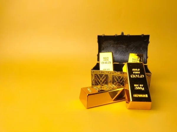 Treasure box with gold bar on a yellow background