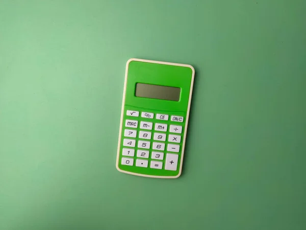 Grüner Taschenrechner Von Oben Auf Grünem Hintergrund Geschäftskonzept — Stockfoto