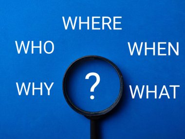 Magnifying glass with the word Where,who,when,why,what on a blue background