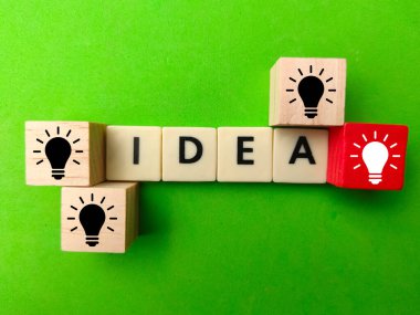 Colored cubes with bulbs and idea words. Concept idea.
