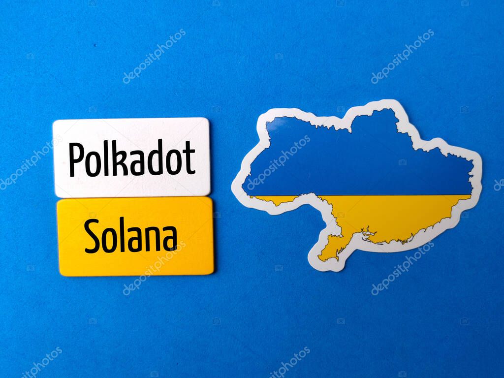 Top view ukraine flag with text Polkadot Solana on blue background.