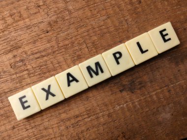 Üst görünüm oyuncakları kelime tahtadan arka planda EXAMPLE metin.