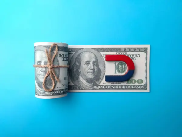 stock image Dollar banknotes money and red blue magnet. Money laundering