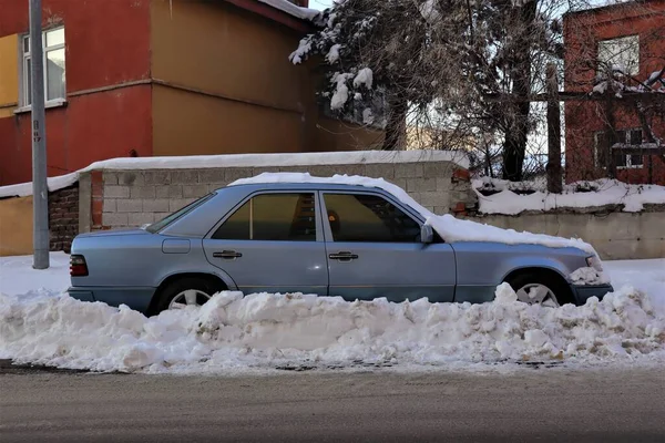 After a blizzard night some cars got stuck in snow. Erzurum in Turkey. This city temperature can reach -50 C. car in cold weather in winter. Snowstorm, Freeze. Ice, freezing, frosting