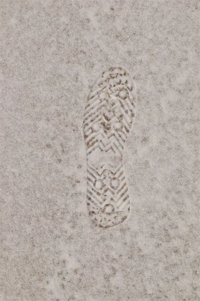 Footprint. Human footprint on the snow.Footprint man on the earth. track, Tracks, Footprints. foot prints, feet print on snow. man walk, winter landscape On a cloudy day