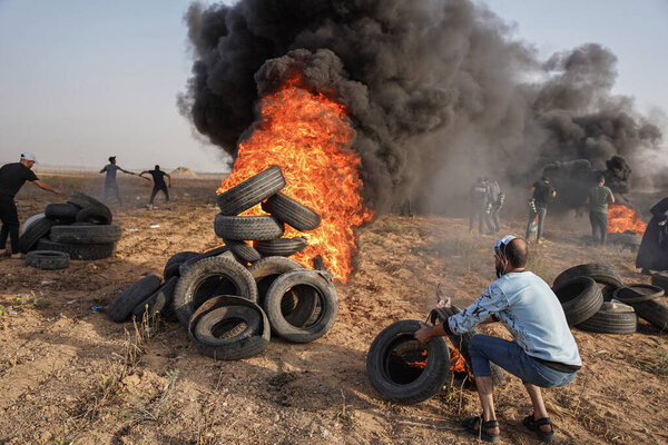 Palestinians demonstrate at the Gaza Strip border. October 25, 2022, Gaza Strip, Palestine: Palestine A large number of Palestinian youths burn rubber tires On the eastern border of Gaza City, as an expression of their anger at the Israeli army