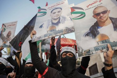 Lions 'Den, Gazze sokaklarında bir yürüyüş düzenliyor. 10 Aralık 2022, Gazze, Filistin: Gazze 'de Hamas' ın Gazze 'deki 35. fırlatılışı kapsamında Gazze' nin merkezinde bir yürüyüş düzenledi.. 