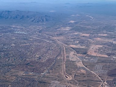 Aerial View of Phoenix-Arizona. February 06, 2023, Phoenix, Arizona, USA: Aerial view of Phoenix in Arizona from an airplane with lots of mountains and hills .