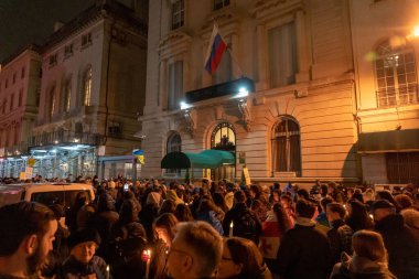 Candlelight Vigil For Ukraine's Resilience and Resistance. February 23, 2023, New York, USA: People with Ukrainian Flags, anti-war sign and candles gather at a candlelight vigil on the eve of the one year anniversary of full-scale Russian invasion