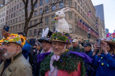 2023 New York City Easter Bonnet Parade. April 09, 2023, New York, New York, USA: People wearing costumes and lavishly decorated hats returned for the Easter Parade and Bonnet Festival 2023 outside St. Patrick's Cathedral along Fifth Avenue clipart