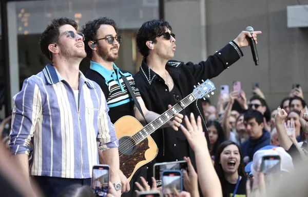 stock image Jonas Brothers Perform live on Today Show. May 12, 2023, New York, USA: The Jonas Brothers are kicking off the Citi Concert Series live on TODAY in Rockefeller center. 