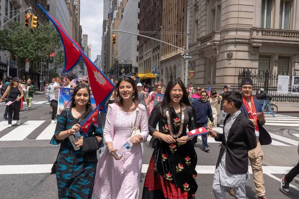 stock image Nepal Day Parade 2023. May 21, 2023, New York, New York, USA: Participants in traditional cloths with flags and banners march at the New York City Nepal Day Parade on Madison Avenue on May 21, 2023 in New York City.  