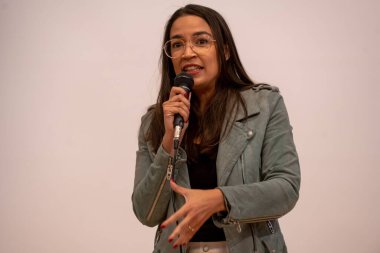 Alexandria Ocasio-Cortez Town Hall. May 26, 2023, New York, New York, USA: U.S. Representative Alexandria Ocasio-Cortez speaks at a town hall meeting at the Corona Arts and Sciences Academy on May 26, 2003 in the Queens borough of New York City clipart