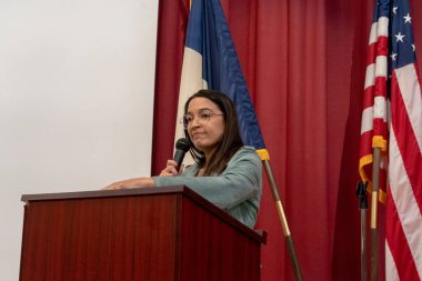 Alexandria Ocasio-Cortez Town Hall. May 26, 2023, New York, New York, USA: U.S. Representative Alexandria Ocasio-Cortez speaks at a town hall meeting at the Corona Arts and Sciences Academy on May 26, 2003 in the Queens borough of New York City clipart