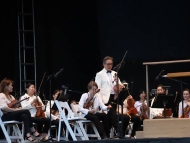 Parktaki New York Filarmoni Konserleri. 14 Haziran 2023, New York, ABD: New York Filarmoni Orkestrası da dahil olmak üzere birçok kişinin katılımıyla New York 'taki Central Park Great Lawn' da düzenlenen Parklardaki konserler.