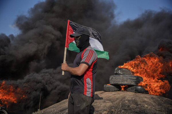 Palestinian youths set fire to rubber tires on the eastern borders of the Gaza Strip. June 19, 2023, Gaza, Palestine: Palestinian youths set fire to rubber tires on the borders of the Gaza Strip