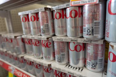(NEW) Artificial Sweetener Aspartame Possible Carcinogen. June 30, 2023, New York, New York, USA: Cans of Diet Coke carbonated diet drinks on a retail shelf on June 30, 2023 in New York City.  clipart