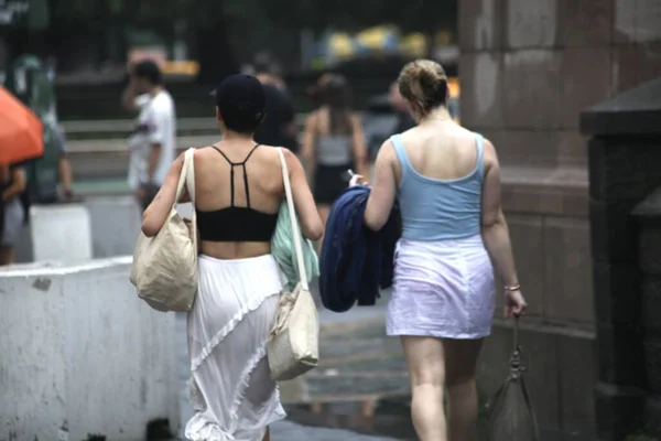 stock image New Yorkers celebrate July 4th Independence under Rainfall. July 4, 2023, New York, USA: Many New Yorkers and tourists who had to improvised different ways of protections from rain, were caught off guard as they got stranded in subway station