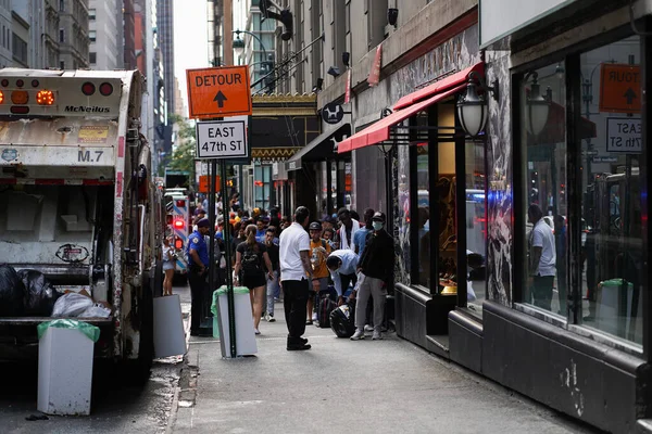 stock image Migrants Outside the Roosevelt Hotel, August 03. 2023, New York ,USA: In a concerning development, hundreds of migrants had been sleeping outside the Roosevelt Hotel for days. fortunately, some were relocated to a church in Long Island City i