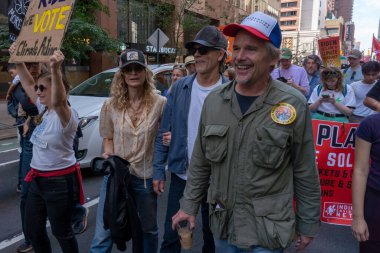 Thousands march in New York to demand that Biden end fossil fuels; Amid U.N. Climate Summit. September 17, 2023, New York, USA: Actors Kyra Sedgwick, Kevin Bacon and Ethan Hawke join thousands of activists, indigenous groups.  clipart