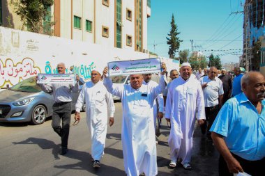 Mülteciler için Ortak Komite 'nin Gazze' deki basın toplantısı. 21 Eylül 2023, Gazze, Filistin: Filistinliler Birleşmiş Milletler Yardım ve İş Ajansı önünde düzenlenen Mülteciler Ortak Komitesi basın toplantısına katıldılar