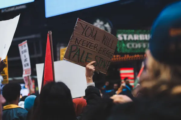 stock image Palestinians Protest From Times Square to Israeli Consulate. October 08, 2023, New York, USA: Palestinian protestors march from Times Square to Israeli Consulate to protest against Israels declaration of war, Bidens support 