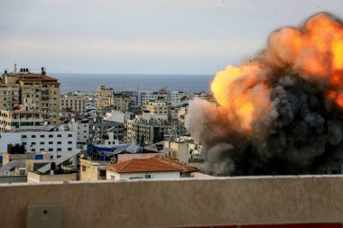 (INT) Smoke and flames billow after Israeli forces hit a high-rise tower in Gaza City. October10, 2023, Gaza, Palestine: Palestinian militants have started a 