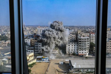 (INT) Smoke and flames billow after Israeli forces hit a high-rise tower in Gaza City. October10, 2023, Gaza, Palestine: Palestinian militants have started a 