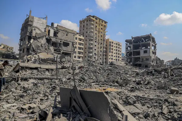 Stock image Members of a Palestinian family inspect the damage inside their home after night time Israeli airstrikes. October 10, 2023. Gaza, Palestine