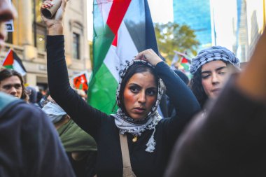 Palestinians Protest From Times Square to Israeli Consulate. October 13, 2023, New York, USA: Palestinian protestors march from Times Square to United Nations Headquarters to protest against Israels attacks on Palestinians clipart