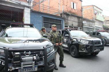 SAO PAULO, BRAZIL - 10/31/2023: Army carried out an operation with the support of the Military Police in the favela in Vila Nova Galvao, City Guarulhos, to fulfill a search warrant related to missing weapons  clipart