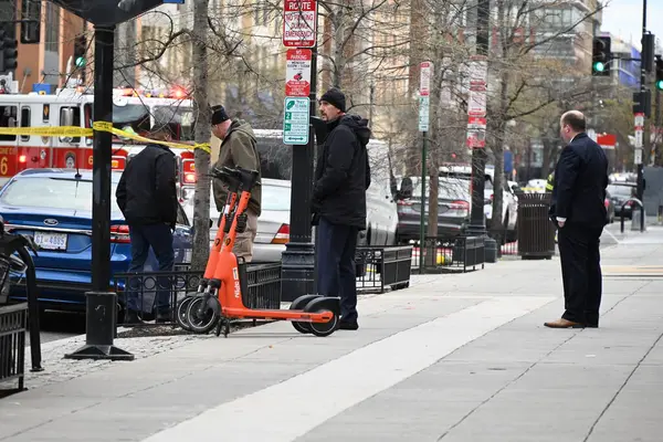 stock image Investigators at the scene gathering information on the mass shooting, Sunday morning as the fire department washes down blood and other debris from the incident that left seven people shot and two dead